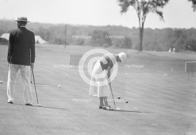 Cassidy, Ellen, Mrs., playing golf, 1932 July. Creator: Arnold Genthe.