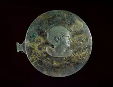 Cast bronze mirror-cover with bust of a woman in relief, 1st century BC - 1st century AD