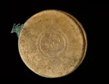Cast bronze mirror-cover with bust of a woman in relief, 1st century BC - 1st century AD