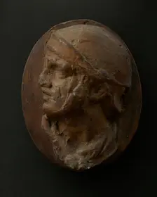 Cast of the head of Roman soldier in helmet and scarf with raised right arm. Creator: Unknown