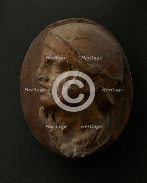 Cast of the head of Roman soldier in helmet and scarf with raised right arm. Creator: Unknown.