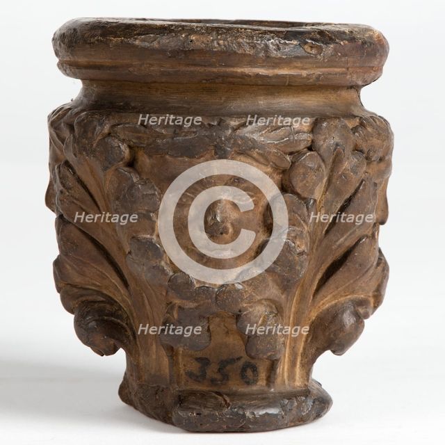 Cast of a medieval capital with leaf foliage and faces, possibly representing the Green Man, c1870. Creator: Unknown.