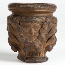 Cast of a medieval capital with leaf foliage and faces, possibly representing the Green Man, c1870. Creator: Unknown