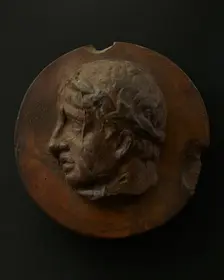 Cast of clean-shaven Roman man wearing a wreath. Creator: Unknown
