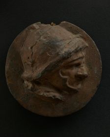 Cast of foreshortened head of Roman soldier in helmet. Creator: Unknown