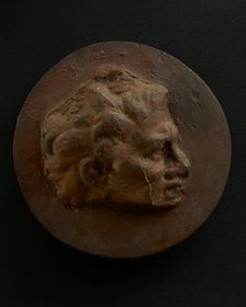 Cast of head of man with hair that springs off brow in thick tufts. Creator: Unknown