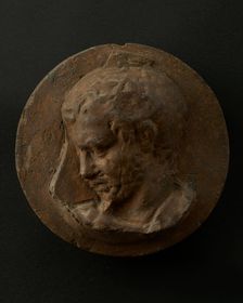 Cast of head of oarsman looking down, with vertical edge of building behind. Creator: Unknown