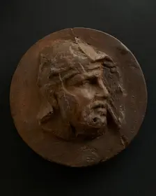 Cast of head of barbarian auxiliary with moustache in helmet. Creator: Unknown