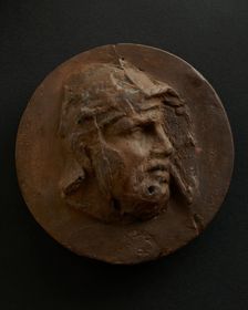 Cast of head of barbarian auxiliary with moustache in helmet. Creator: Unknown