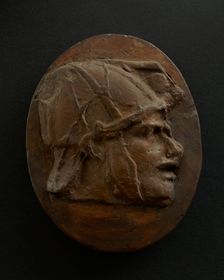 Cast of head of Eastern archer with helmet. Creator: Unknown