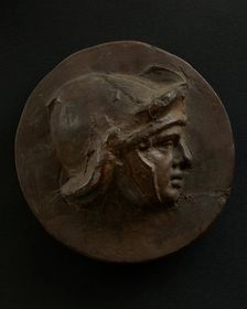 Cast of head of full-faced, young Roman soldier in helmet. Creator: Unknown