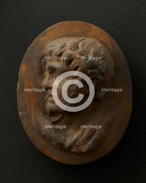 Cast of head of lightly-bearded man wearing wreath (?) and with mouth open. Creator: Unknown.