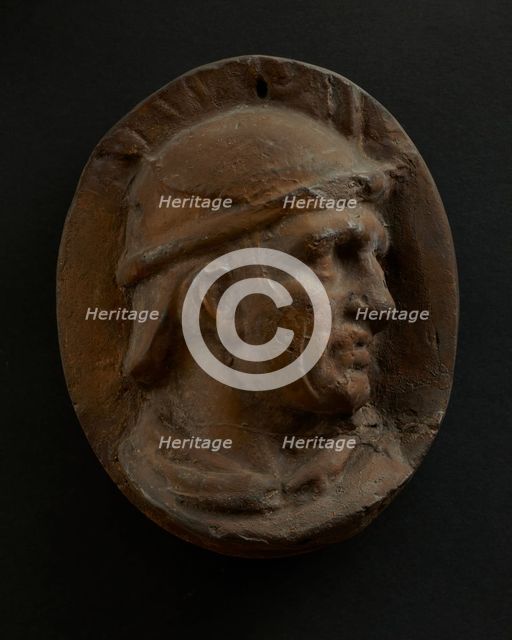 Cast of head of Roman auxiliary in round helmet. Creator: Unknown.