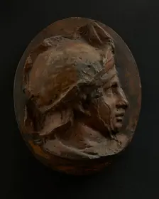 Cast of head of young auxiliary wearing a helmet. Creator: Unknown
