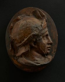 Cast of head of young auxiliary wearing a helmet. Creator: Unknown