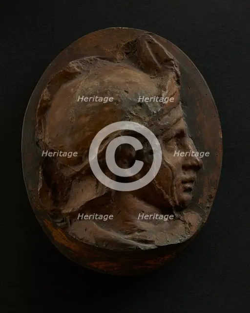 Cast of head of young auxiliary wearing a helmet. Creator: Unknown.
