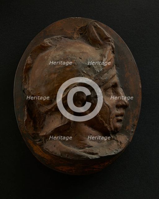 Cast of head of young auxiliary wearing a helmet. Creator: Unknown.