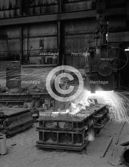 Casting a 1 in 14 rail crossing, Sheffield, South Yorkshire, 1964. Creator: Michael Walters.