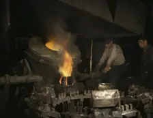 Casting a billet from an electric furnace, Chase Brass and Copper Co., Euclid, Ohio, 1942. Creator: Alfred T Palmer