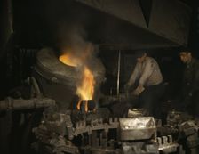 Casting a billet from an electric furnace, Chase Brass and Copper Co., Euclid, Ohio, 1942. Creator: Alfred T Palmer