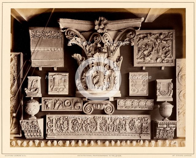 Casts of Roman capital, possibly from Pantheon, late Roman frieze and other fragments, 1876. Creator: Bedford Lemere and Company.