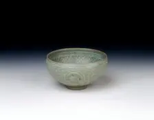 Celadon bowl with inlaid design of storks amid clouds, Koryo dynasty, Korea, 13th century. Creator: Unknown