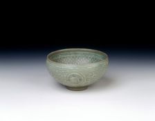 Celadon bowl with inlaid design of storks amid clouds, Koryo dynasty, Korea, 13th century. Creator: Unknown