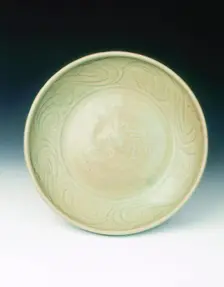 Celadon dish with moulded tree and incised scrolls, Yuan-Ming dynasty, China, 14th century. Creator: Unknown