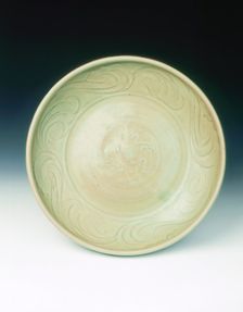 Celadon dish with moulded tree and incised scrolls, Yuan-Ming dynasty, China, 14th century. Creator: Unknown