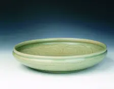 Celadon dish with moulded tree and incised scrolls, Yuan-Ming dynasty, China, 14th century. Creator: Unknown