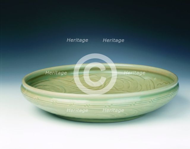 Celadon dish with moulded tree and incised scrolls, Yuan-Ming dynasty, China, 14th century. Creator: Unknown.