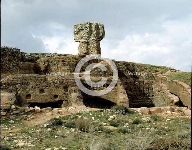 Celtiberian Roman rock city of Tiermes, detail of the rock digged houses, with the Roman baths at…