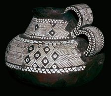 Celtic jug with double handles and volute decorations, 8th century BC