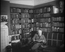 C.E.M Joad Reading a Book, 1930s. Creator: British Pathe Ltd