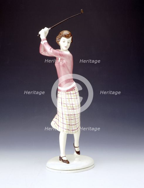 Ceramic figurine of a lady golfer, c1920s. Creator: Unknown.