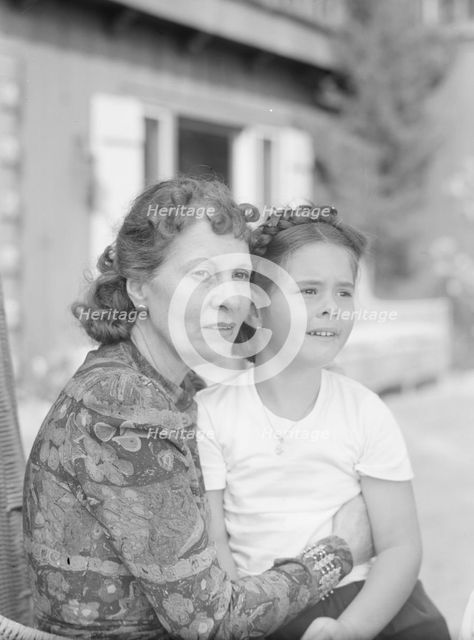 Churchill, Mrs., with child Orrin, seated outdoors, not before 1932 Mar. Creator: Arnold Genthe.