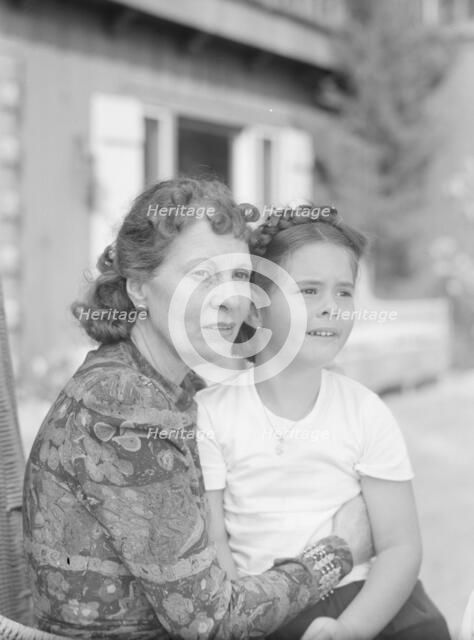 Churchill, Mrs., with child Orrin, seated outdoors, not before 1932 Mar. Creator: Arnold Genthe.