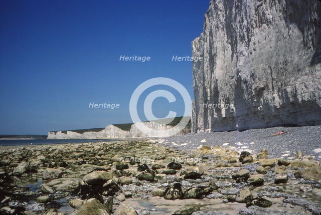 Chalk Cliffs and Beach, looking West, Birling Gap, Sussex, 20th century. Artist: CM Dixon.