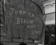 Chalk Graffiti on the Tarpaulin Covering a Lorry Reading JUMP on BERLIN FIRST STOP 1939. Creator: British Pathe Ltd