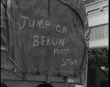 Chalk Graffiti on the Tarpaulin Covering a Lorry Reading JUMP on BERLIN FIRST STOP 1939. Creator: British Pathe Ltd