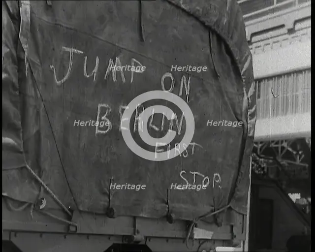 Chalk Graffiti on the Tarpaulin Covering a Lorry Reading 'JUMP on BERLIN FIRST STOP', 1939. Creator: British Pathe Ltd.