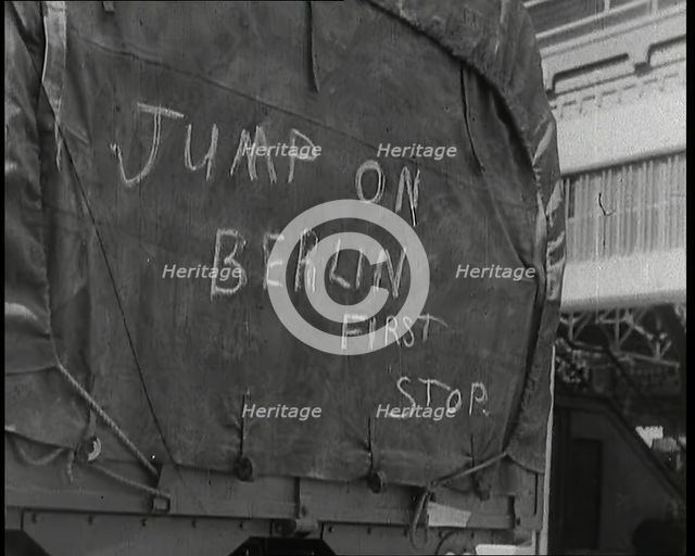 Chalk Graffiti on the Tarpaulin Covering a Lorry Reading 'JUMP on BERLIN FIRST STOP', 1939. Creator: British Pathe Ltd.