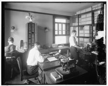 Chamber of Commerce mail room, between 1910 and 1920. Creator: Harris & Ewing