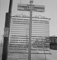 Chamber of Commerce sign, Drew, Mississippi, 1937. Creator: Dorothea Lange