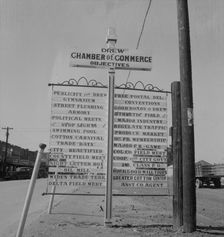 Chamber of Commerce sign, Drew, Mississippi, 1937. Creator: Dorothea Lange