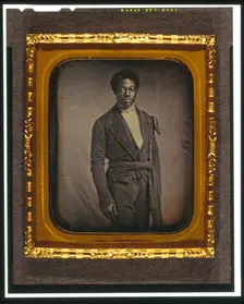 Chancy Brown, three-quarter length portrait, facing front, between 1856 and 1858. Creator: Augustus Washington