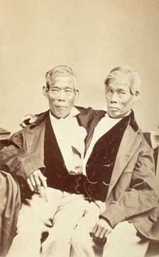 Chang and Eng, conjoined twins, seated, c1860. Creator: Unknown