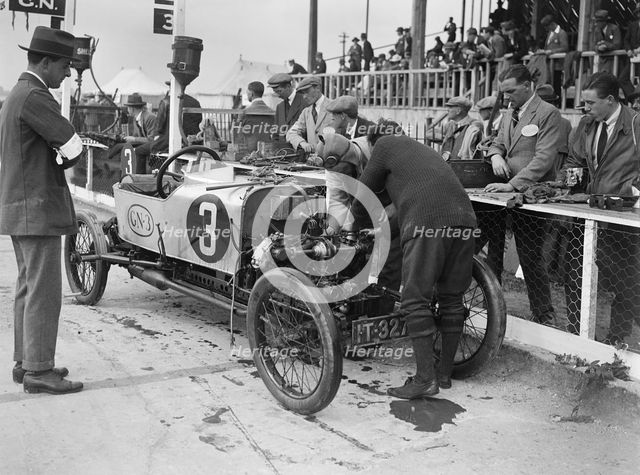 Changing a piston on Archie Frazer-Nash's GN at the JCC 200 Mile Race, Brooklands, Surrey, 1922. Artist: Bill Brunell.