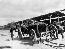 Changing the rims on a De Dietrich car, Coppa Florio Race, Italy, 1908