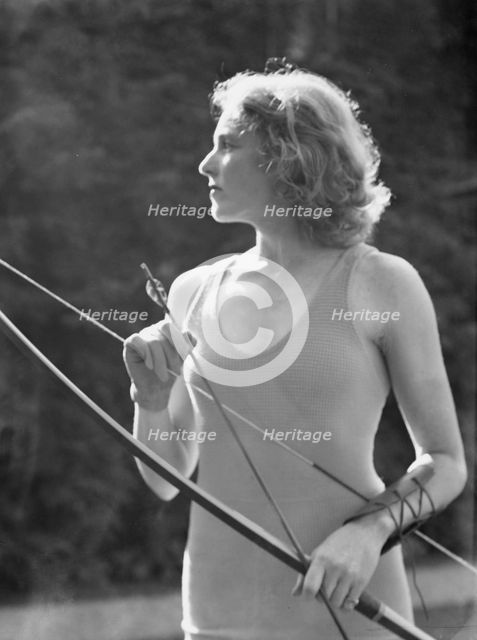 Chase, Diana, Miss, doing archery, 1933 June 22. Creator: Arnold Genthe.